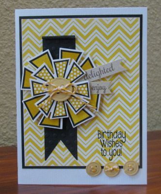 birthday wishes
crazy4daisies stamp set and dies.  sentiment from the spinner stamp set.  buttons created from button dies. :)
