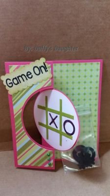 Game on 
Tic tac board with extra game pieces in a baggie
