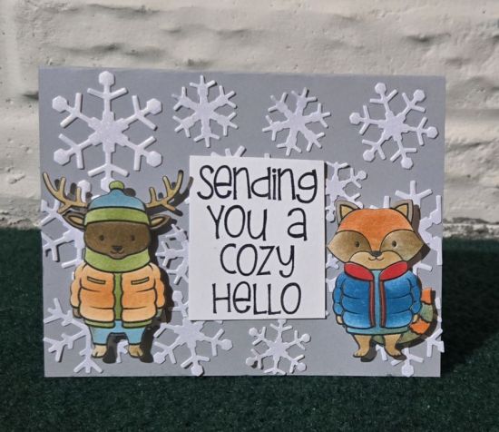 All bundled up critters
Snowflake background 
