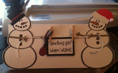 Money Card
Folded, it is a 3x6 1/2 trifold card and with the snowman hanging off the sides and top, it makes the card 4x7 1/2. Holds money or a gift card. 
