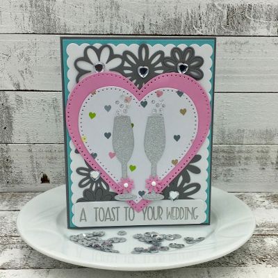 Toast to Your Wedding
words4toasting & dies, Scalloped Rectangle Dies, Sizzix Dotted Heart Dies, Mini Flower Dies, Sizzix Card Flower & Circle Drop-ins, TSOL papers & inks
