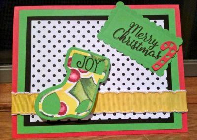 Merry Christmas "Joy"
My 10 y/o girly made this delightful Christmas card. I was surprised by her choice for yellow, yet it complimented the whole card. She lovingly decorated the inside with the star stamp and cut out Christmas tress. 
