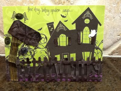 Drop me a line
Super fast to do, most of card is a patterned paper. I just added fence that I crumpled, cut a bit, and distressed, the mailbox that I also crumpled & distressed, the saying at top & the spiders that I sparkled up a bit. The shutters are bits cut from the fence to add a little 3-D to the background.  Inside reads "Drop me a line" hanging from a web.
