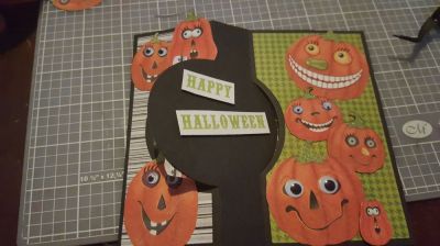 Crazy pumpkins inside
I don't have a lot of stamps so I  fussy cut out enough pumpkins from patterned paper to represent my wacky little family and made a flip it! Googly eyes and eyelashes added  :)
