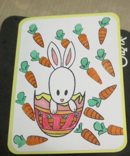 I used bunny2stamp on a rounded A2 size card base. I stamped the carrots on white cardstock and stamped the bunny image. Then I colored everything with markers
