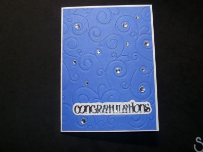 Happy Retirement
This simple card was made using the Textured Impressions Embossing Folder, sky and white TSOL paper, the Congratulations die from the November 2015 card kit, and Signs4Words stamps.  I added some bling and some silver paper to make the card sparkle.  
