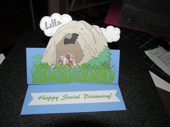 COVID-19
The clouds were from the Dream Big class kit; I also used the grass die, and the card base was the Lively stand-up card base.  In addition, I used the Hello for Sizzix stamp to stamp the cloud, and the bat came from Pumpkin Dies 1.  Lots of little parts and pieces were used to put together this card.  
