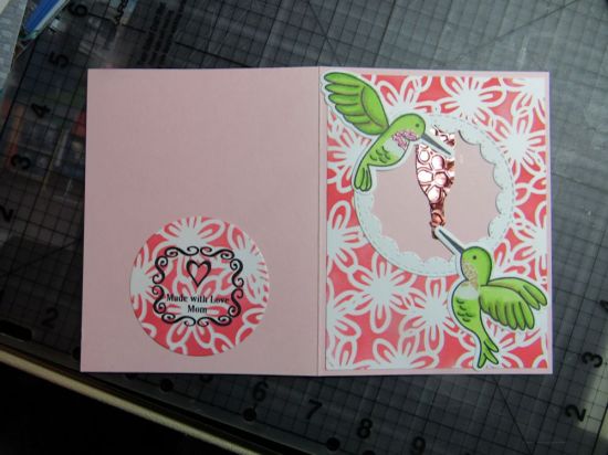 This is a thank you note for a Mother's Day gift.  I don't think you can tell, but the male hummer's throat has been embossed with metallic powder, and I cut the feeder bottle on Cricut and embossed the foiled paper.
Keywords: hummingbird