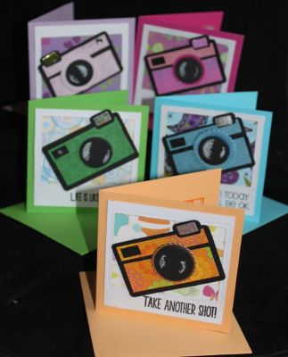 Motivational card pack
This stamp and die set are brilliant for "encouragement" or "motivational" cards so I created a 4" x 4" card set for a friend.  I started with a hand cut polaroid frame, with backgrounds from my scrap box and then camera die cut in matching colours and a sentiment from the stamp set.  On the inside I used the card from centre of the polariod to stamp a message and decorated this with the smaller camera stamp.  On the back I used a club freebie and my name, as I am waiting for my personalised stamp.
Keywords: camera2stamp club stamp and die set