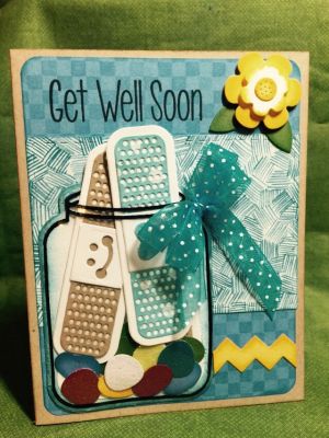 Get Well Soon
Stamped the jar onto an acetate sheet then cut the stamped image with the jar die.  Cut opening at top of jar so I could insert two bandages later. Die cut a second jar from white paper then adhered the jelly beans, gum drops and one bandage to it. Glued the acetate jar to the paper jar.
