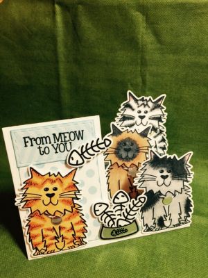 From Meow to You
Used silver metallic paper for cat bowl and tags on cat collars.  Slit cat bowl to insert fish bones. Used Copics for coloring. 
