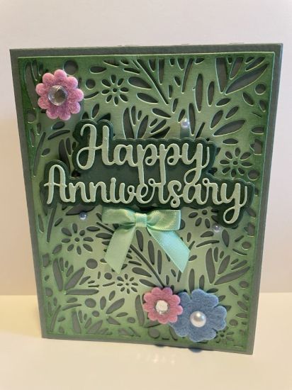 Anniversary card on Foliage Background Die
