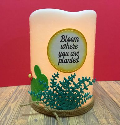 Bloom Electric Candle 
A simple dollar store battery operated candle decorated with a distressed cactus, glittered succulent and thick twine :)
