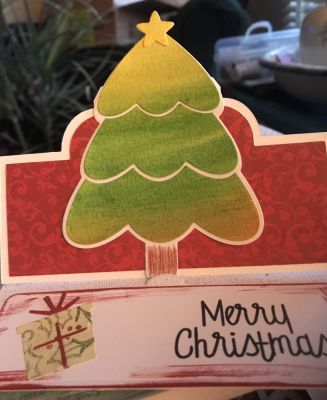 Christmas tree 
Water color tree on a stand-up card. With a die-cut gift from a birthday set.
