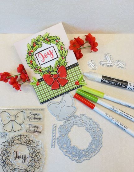 �Joy� Hollywreath2stamp 
Super fun card to make�and pretty easy also.  Everything I used to make this card is from �TSOL�. 
