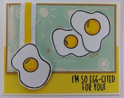 I'm so Egg-cited for you
What better way to say it than with three fried eggs? These were stamped in black ink and colored in with yellow and orange watercolor paint. One quick circle of orange on top of the yellow, around the outer edges give the egg yolk a shadowed dimensional look. I hand cut these but should have used the cutting dies with this set to get a much smoother edge. The sentiment "I'm so Egg-cited for you" is just one of the clever sayings in this set.
Keywords: eggs