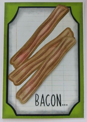 Realistic looking bacon on the front of a card...is ALMOST good enough to eat! (But don't)
This bacon was colored in with red and brown distress inks. The lines of bacon fat are shaded in darker to make them look realistic. Using a background of notebook paper and green with black cardstock behind it, complimented the bacon strips coloring. Inside the card is stamped with the sentiment "Admit it, for one minute all your problems went away". (Which always makes the reader laugh).
Keywords: bacon
