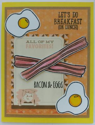 All of my favorites...Bacon and Eggs!
Bacon and eggs look like this little boys' favorites with his fork and knife in hand. The bacon is popped off the page using a foam adhesive dot and is criss crossed over one another. Two eggs sit in opposite corners of the card. Both were water colored with yellow and orange paint. Using yellow and orange papers give it a cheery sunny breakfast look.
Keywords: eggs bacon