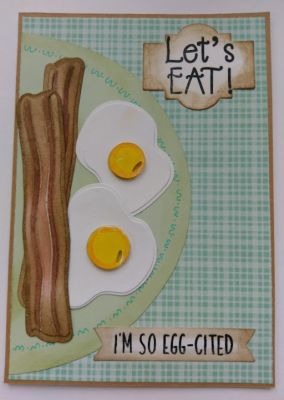 Let's Eat...I'm so Egg-cited
Combining the sentiments from the two sets of bacon & egg themed stamps is fun but blocking out some of the words to get it to say exactly what you want, is awesome! The "Let's eat" comes from one set and the "I'm so Egg-cited" is the top line only of a two line sentiment stamp from the other set. A circle was cut for the plate and then decorated with an edge design. 
Keywords: eggs bacon