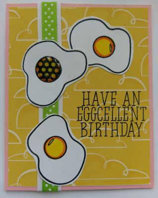 A very clever way to say Happy Birthday
"Have an Eggcellent Birthday". These stamped eggs were simple to water color and look dimensional because of the orange shading around their edges. I decided to make one egg yolk different by stamping it in with the checkered pattern circular yolk stamp. A bright polka-dotted green ribbon runs up the length of the card for additional color. 
Keywords: eggs birthday