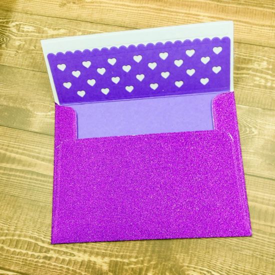 Glitter envelope 
Purple glitter paper envelope using a2 envelope die and scallop envelope die liner
