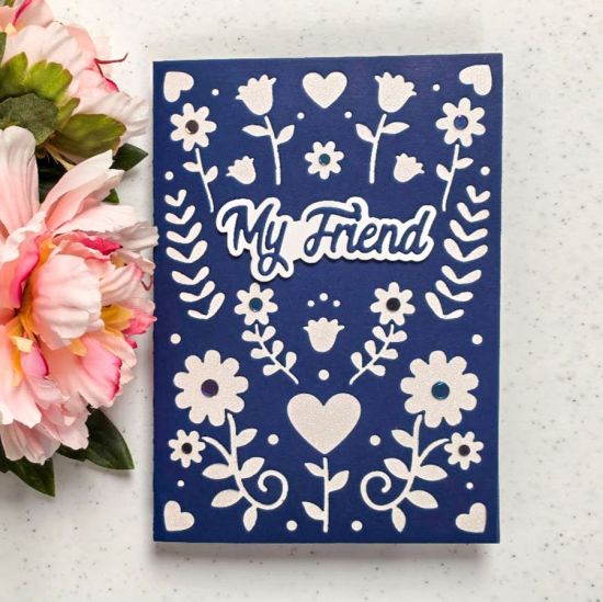 White panel added to inside flap and blue gems added as flower centers on cover
