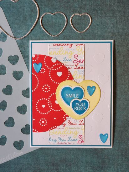 Smile, You Rock
Stencil was used to emboss the white background. Sentiment hearts die cut from the paper pad.
Keywords: Candyhearts2stamp candy hearts 3 pack stencils Sending you Love paper pad