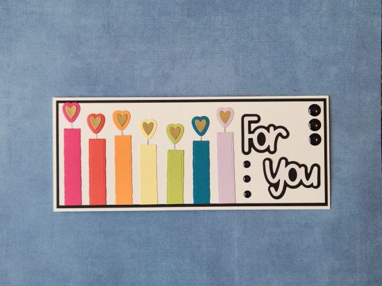 Deckled Candles
Birthday card featuring candles made with slimline deckle die and hearts for the flames. 
