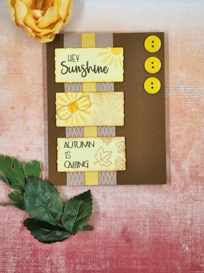Hey Sunshine, Autumn is Calling
Using lots of sets, along with ribbon and buttons from card kits. The stencil from the Bicycle Fold-It Club January 2023 was used for the sun. 
Keywords: deckle edge shapes pocket2stamp wagon2stamp pineapple2stamp posies2stamps bicycle fold-it
