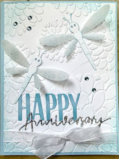 Dragonflies anniversary card
An Anniversary card with dragonflies. I used vellum for the wings and stamped with build a mandala on the underside.  Glacier and white are the colors
Keywords: Anniversary dragonflies
