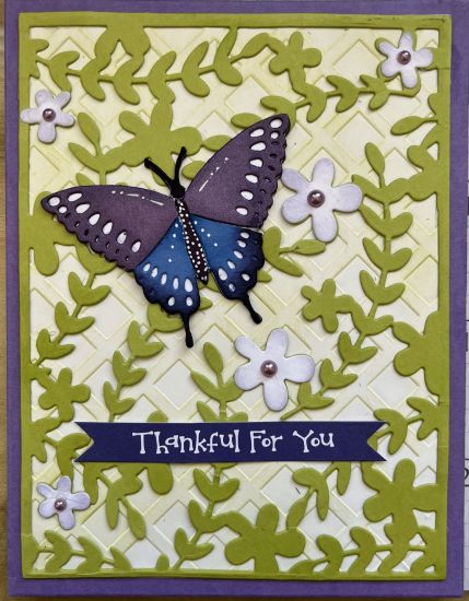 Butterfly on a vine
a purple and blue butterfly on the vine and grid A2 card base. Lattice embossing folder in the background
Keywords: A2 flower vine butterfly thankful