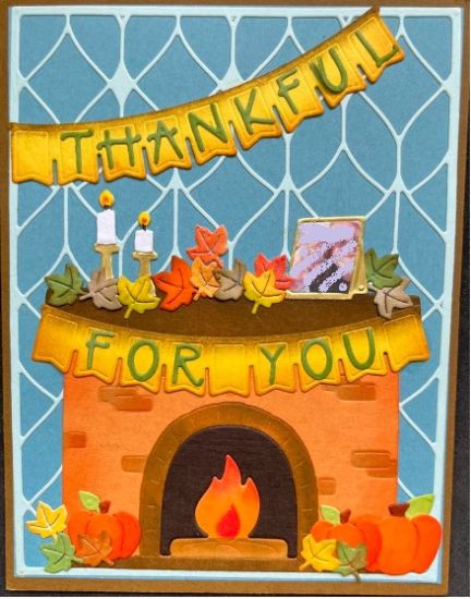 Thanksgiving Fireplace
A fireplace with a photo of the recipients in the frame on the mantle. I have scribbled out the photo for privacy reasons. 
Keywords: fireplace thanksgiving photo mantle
