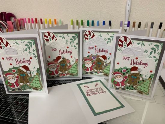 Christmas Cards using Mug Fold It
I used the Mug Fold it; Candy Cane from Ginger Bread house fold it; Background from Online Class 3 Swag stamp set; Outside Sentiment from Solids4JingleBells; Marshmallow cream from Cloud Border Die; Inside sentiment from Gingerbread fun; and Santa2stamp; 5x7 card dies
Keywords: Christmas Cards