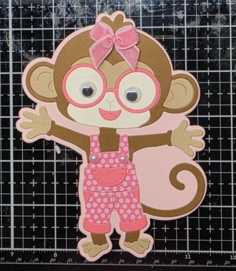 A2 Monkey Fold-It, outfit is from happy little Posies paper pad and cherry cardstock, plus a velvet bow to finish her off
