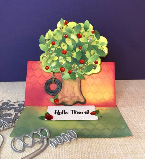 This was a happy accident. I had an extra white background from the Flower Vase Fold-it and decided to ink it in greens to cut some extra leaves out of it. When I was finished, I was surprised at how much it looked like a tree (and shaker card) just waiting to happen.
Keywords: fold-it, tree, easel card